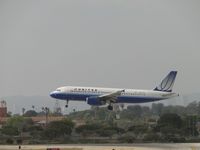 N467UA @ LAX - Landing 24R - by Helicopterfriend