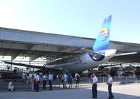 D-AICE @ EDDB - Airbus A320-212 of Condor with 'Peanuts' special design in the maintenance Hangar of Berlin-Schönefeld airport during the ILA 2010