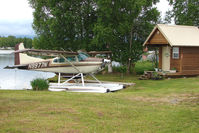 N9977N @ LHD - 1976 Cessna 180J, c/n: 18052632 on a pleasant dock at Lake Hood
