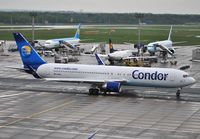 D-ABUE @ EDDF - Condor taxiing for departure on a very wet morning - by Robert Kearney