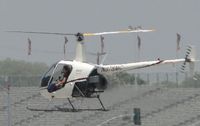 N878MC @ POC - Taxiing across active runway to practice area - by Helicopterfriend