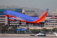 N233LV @ LAS - Southwest Airlines N233LV (FLT SWA738) departing RWY 25R enroute to Los Angeles Int'l (KLAX). - by Dean Heald