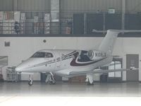 N108JA @ ONT - Parked in the hanger on a gloomy morning - by Helicopterfriend