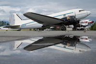 N305SF @ PAAQ - Bush Air Cargo DC3 - reflection - by Dietmar Schreiber - VAP