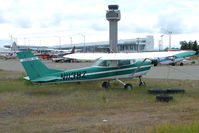 N1138Z @ LHD - 1969 Cessna 150J, c/n: 15069760 at Lake hood with ANC Control Tower in background