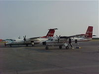 N886EA @ PANC - ERA Aviation N886EA Dehavilland DHC-6-300 next to N883EA Era Aviation Dash 8 at PANC.