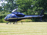 G-BOSN @ X2FF - Aerospatiale AS355F1 Ecureuil II being used for ferrying race fans to Silverstone for the British Grand Prix from this temporary heliport a few miles east of Bicester - by Chris Hall