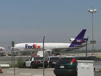 N580FE @ ONT - Parked west of Airport Police Bldg, behind Fed Ex bldg. - by Helicopterfriend