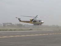 N120LA @ POC - While air taxiing south, rotor wash is cleaning the taxiway off - by Helicopterfriend