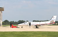 N701VV @ KDPA - TFH AVIATION LLC Cessna 550 Citation Bravo, N701VV getting a tow into the hangar KDPA. - by Mark Kalfas