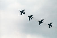 J-4021 @ EGDM - Hunter F.58 J-4021 leading the Patrouille Suisse display team into the landing break at the 1990 Boscombe Down Battle of Britain 50th Anniversary Airshow. - by Peter Nicholson