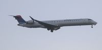 N803SK @ KMSP - Poor photo of a Delta Connection CRJ landing at MSP. - by Kreg Anderson