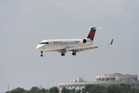 N8659B @ KAUS - DAL CRJ over the numbers 17L. - by Darryl Roach