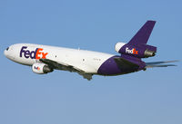 N357FE @ KPHL - FedEx MD-10 climbing out from 27L at PHL. - by T.P. McManus