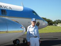 61-2490 - Brig. General James U. Cross (retired) stands with one of the JetStar he piloted for President Johnson.  The photo was made on the LBJ Ranch taxiway with Texas White House in background. - by Russ Whitlock