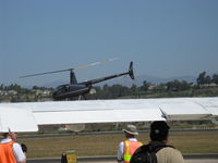 N590H @ CMA - 2008 Robinson R44 RAVEN II, Lycoming IO-540-AE1A5 245 Hp for 5 minutes, 205 Hp continuous, quick grab shot, departure - by Doug Robertson