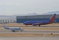 N525PB @ KTUS - JCL AVIATION Cessna 525A, Taxiway Alpha - SouthWest N485WN arriving on 11L KTUS. - by Mark Kalfas