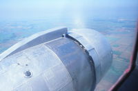 N47CE - Looking over left engine somewhere near Rockford, IL - by Glenn E. Chatfield
