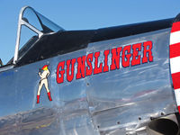 N4802E @ KRTS - Close-up of Gunslinger nose art on Race #66 in T-6 Class pits @ 2009 Reno Air Races - by Steve Nation