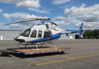 N408AM @ KAXN - LifeLink III Bell 407 on the pad. - by Kreg Anderson