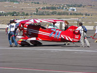N49310 @ KRTS - Race # 711 1982 Aerotek PITTS SPECIAL S-1S getting a push to holding area for second heat of the morning in Biplane Class @ 2009 Reno Air Races - by Steve Nation