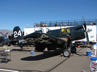 N240CA @ KRTS - Race #24 F4U-4 BuAer 97359 VMFT-20 Marines being worked on pits as NX240CA for Unlimited Class race @ 2009 Reno Air Races - by Steve Nation