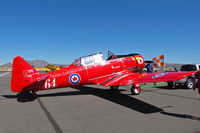 CF-WLO @ KRTS - Race #64 is a CCF Harvard Mk. IV in Royal Canadian Air Force Red Knights colors being towed to active ramp for T-6 Class racing @ 2009 Reno Air Races - by Steve Nation