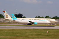 TC-TCE @ EGCC - Turkuaz Airlines A321 taxying past Etihad B777 A6-ETF - by Chris Hall