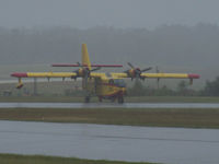 C-GNCS @ KHKY - A very wet day to be out taking photos, but rain was needed.  Possible a Canadair CL-215 - by J.B. Barbour