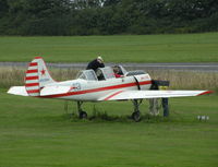 G-BWSV @ EGTR - Some head scratching after unsuccesfully trying to start this Yak 52 - by BIKE PILOT