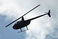 PH-WMW @ EHAM - R44 flying over