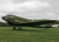 N7772 @ WS17 - The EAA DC-3 sits out a frigid Wisconsin wind storm with characteristic stoicism. - by Daniel L. Berek