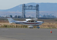 N800TX @ KAPC - Framed against the Napa River RR bridge this 1999 Cessna 182S taxis for trip home to KCMA (Camarillo, CA) - by Steve Nation