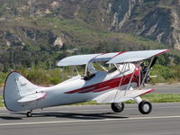 N32135 @ SZP - 1941 Waco UPF-7, Continental W670 220 hp radial, stunning show plane, landing roll Rwy 22 - by Doug Robertson