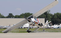 N7080D @ KOSH - Recovered with no further inccident, removed paint on the tip of the wing and horizontal tail and damaged right main gear.