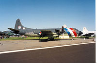 304 @ EGDM - P-3C Orion, callsign NRN 361, of 320 Squadron Royal Netherlands Navy in anniversary markings on display at the 1992 Air Tournament Intnl at Boscombe Down. - by Peter Nicholson