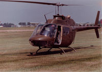71-20527 - OH-58A that flew with Hq & Hq Company, 372nd Engineer Group 9USAR) at Fort Des Moines, Iowa in the 1980s.  I am at the controls with the red stripes on the visor of my flight helmet.  Was reregistered as N1045C in NOV of 2002. - by Bookie