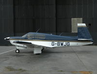 G-BWJG @ EGTR - Nice Mooney in front of the main hanger. - by BIKE PILOT