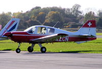 G-AZCN @ EGNE - Previous ID: HB-NAY, hence the Swiss flag on the tail - by Chris Hall