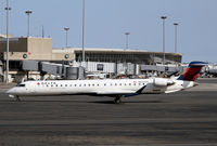 N676CA @ BOS - Looks like a little paint is needed on the tail. - by Duncan Kirk