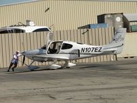 N107EZ @ CNO - Being pushed back from the paint shop area fence - by Helicopterfriend
