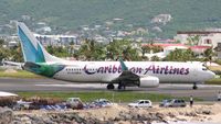 9Y-SLU @ TNCM - Caribbean airlines at the tresh hold for departure - by Daniel Jef