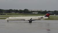 N691CA @ KMSP - Stormy day in MSP - by Todd Royer