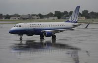 N649RW @ KMSP - Stormy day in MSP - by Todd Royer