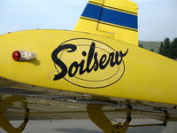 N6024M @ KKIC - Close-up of Soilserv logo on port wing of Air Tractor AT-401 @ Mesa Del Rey Airport, King City, CA (destroyed Dec 6, 2007 when aircraft failed to pull out of turn and hit high ground while applying wheat seed NW of King City, CA; pilot OK) - by Steve Nation