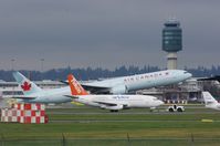 C-GNAU @ YVR - Being towed to the parking area - by metricbolt