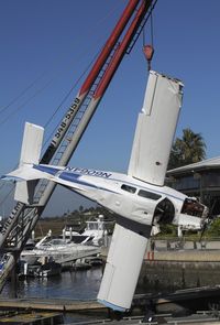 N6064N @ SNA - Beach 19A lifted by a crane the day after it crashed in shallow water just short of SNA Airport resulting in 3 fatalities. - by Mike Khansa