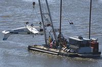 N6064N @ SNA - Beach 19A being hauled away from where it crashed in shallow water just short of SNA airport killing all 3 persons on board! - by Mike Khansa