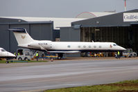 N247EM @ EGGW - Gulfstream Aerospace GV-SP (G550), c/n: 5265 at Signature Luton for maintenance - by Terry Fletcher