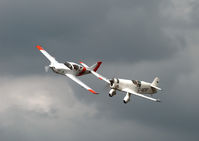 G-AEXF @ EGBR - Mew Gull flying alongside Taff Smiths Glassair over Breighton Airfield - by PETER LAMB